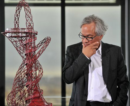 Indian-born artist Anish Kapoor looks at a model of his design during the launch of the "ArcelorMittal Orbit" sculpture at City Hall in central London, on March 31, 2010. Mayor of London Boris Johnson and Lakshmi Mittal, CEO of ArcelorMittal, unveiled on Wednesday The ArcelorMittal Orbit - the winning design for the 2012 Olympic and Paralympic sculpture, conceived by Turner Prize winning artist, Anish Kapoor. This unveiling also marks ArcelorMittals confirmation as a tier two sponsor of the Olympic and Paralympic Games. AFP PHOTO/Leon Neal