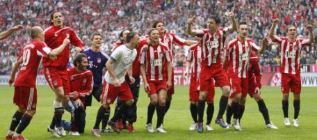 Munich's player celebrate after winning the German first division Bundesliga soccer match between FC Bayern Munich and VfL Bochum in Munich, Germany, on Saturday, May 1, 2010. (AP Photo/Matthias Schrader) ** NO MOBILE USE UNTIL 2 HOURS AFTER THE MATCH, WEBSITE USERS ARE OBLIGED TO COMPLY WITH DFL-RESTRICTIONS, SEE INSTRUCTIONS FOR DETAILS **