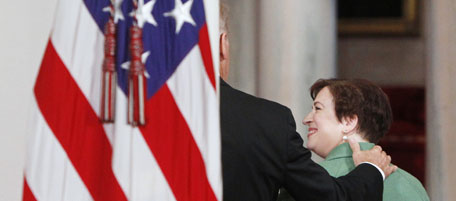 Vice President Joe Biden (L) escorts nominee for Supreme Court Justice, Solicitor General Elena Kagan, off the podium in the East Room at the White House in Washington May 10, 2010. Kagan is Obama's choice to replace retiring Supreme Court Justice John Paul Stevens. REUTERS/Jim Young (UNITED STATES - Tags: POLITICS CRIME LAW IMAGES OF THE DAY)
