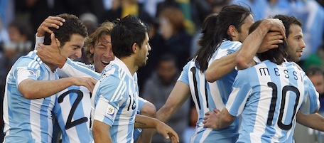 Argentina's Gonzalo Higuain, left, celebrates with teammates after scoring his side's fourth goal during the World Cup group B soccer match between Argentina and South Korea at Soccer City in Johannesburg, South Africa, Thursday, June 17, 2010. (AP Photo/Ricardo Mazalan)