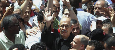 Former Director General of the International Atomic Energy Agency (IAEA) and Nobel Peace Prize laureate Mohammed ElBaradei waves during a demonstration to protest at what they call systematic torture by the police after the alleged beating death of a young man in the Mediterranean port city of Alexandria, Egypt, Friday, June 25, 2010. It is the latest protest sparked by the death this month of Khaled Said, who witnesses say was beaten to death by police on an Alexandria street. The government says he suffocated from swallowing drugs, despite photos of his body showing his jaw smashed.(AP Photo/Tarek Fawzy)