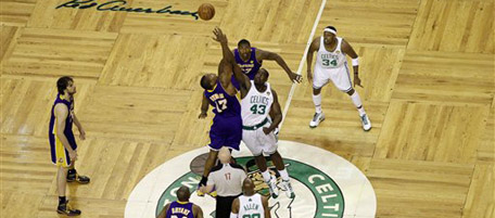 Los Angeles Lakers center Andrew Bynum (17) and Boston Celtics center Kendrick Perkins (43) tip off Game 5 of the NBA basketball finals Sunday, June 13, 2010, in Boston. (AP Photo/Charles Krupa)