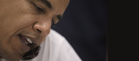 Democratic presidential candidate, Sen. Barack Obama, D-Ill., talks on the phone with a potential voter at his campaign office in Brighton, Colo., Sunday, Oct. 26, 2008. (AP Photo/Jae C. Hong)