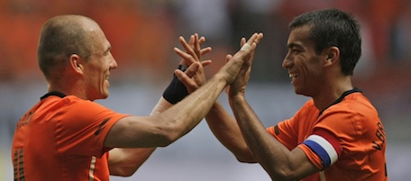 Arjen Robben, left, and Giovanni van Bronckhorst of the Netherlands react after Robben scored during the friendly soccer match Netherlands versus Hungary at ArenA stadium in Amsterdam, Netherlands, Saturday June 5, 2010. Robben suffered a hamstring injury and will not fly out to South Africa with the Dutch team in order to determine the exact nature of his injury in a Dutch hospital. (AP Photo/Peter Dejong)