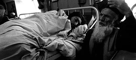 Orthopedic center, Afghanistan, March 2003.A patient under treatment lays down on the bed.The center is in operation in Kabul since 1988. The majority of patient amputees is victim of mines.