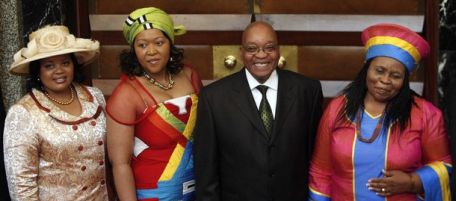 South African President Jacob Zuma poses for photographs with his three wives Sizakele Khumalo (R), Nompumelelo Ntuli (L) and Thobeka Mabhija after delivering his state-of-the-nation address in parliament in Cape Town June 3, 2009. South Africa must act now to minimise the impact of the global financial crisis on the poor, but still has to spend wisely, Zuma said on Wednesday in his first major speech as the country's leader. REUTERS/Mike Hutchings (SOUTH AFRICA POLITICS)