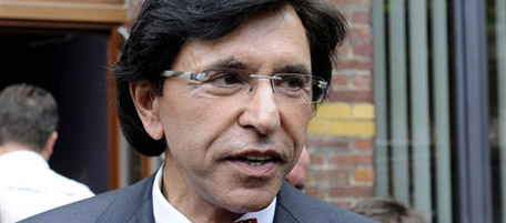 French-speaking Socialist Party President Elio Di Rupo speaks to the media after casting his ballot in Mons, Belgium on Sunday, June 13, 2010. Belgians vote Sunday in general elections that are widely seen as a vote on an orderly breakup of this country where 6.5 million Dutch- and 4 million French-speakers are locked in a quarrelsome union. (AP Photo/Thierry Charlier)