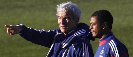 France soccer coach Raymond Domenech talks with Captain Patrice Evra prior to decided to cancel the training session in Knysna, South Africa, Sunday, June 20, 2010. France's World Cup team refused to train Sunday in protest of Nicolas Anelka's expulsion from the squad. Anelka was kicked off the team a day earlier for a profanity-laced tirade against coach Raymond Domenech, whose tactics and management skills have been called into question. (AP Photo/Francois Mori)