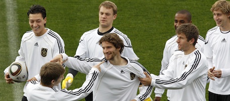 Germany's Toni Kroos, Thomas Mueller and Arne Friedrich, front from left, joke during a training session of the German national soccer team in Tshwane, South Africa, Friday July 9, 2010. Germany plays against Uruguay during the soccer World Cup third place match in Port Elizabeth on Saturday, July 10, 2010. (AP Photo/Michael Sohn)