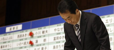 Japanese Prime Minister Naoto Kan bows as he arrives for a press conference during ballot counting in the upper house parliamentary elections at his Democratic Party of Japan election headquarters in Tokyo early Monday, July 12, 2010. Battered by voter backlash over the prospect of higher sales taxes, the ruling party suffered a heavy defeat in Sunday's parliamentary elections, media exit polls showed, dealing a blow that could hinder the young government's ability to control soaring debt. (AP Photo/Greg Baker)