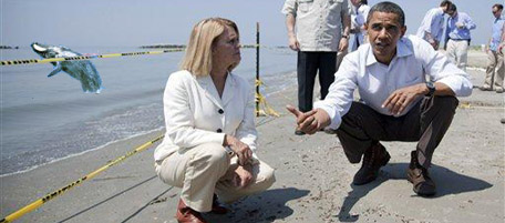 President Barack Obama, right, and LaFourche Parish president Charlotte Randolph take a tour of areas impacted by the Gulf Coast oil spill on Friday, May 28, 2010 in Port Fourchon, La. (AP Photo/Evan Vucci)