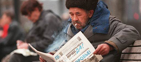 An elderly Russian man reads a newspaper in the centre of Moscow Wednesday November 6, 1996, commenting on Russian President Boris Yeltsin's bypass heart surgery with a headline reading ''patient no. 1, to your health''. Russians took his heart surgery in stride, with some saying they believed their president will be restored to health and able to govern again. Yeltsin Wednesday morning reclaimed his presidential powers including control over Russia's immense nuclear arsenal. (AP Photo/Sergei Karpukhin)