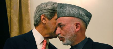 Afghan President Hamid Karzai, whispers with the U.S. Sen. John Kerry, D-Mass during a press conference, in Kabul, Afghanistan on Tuesday, Oct. 20, 2009. Afghanistan's election commission today ordered a Nov. 7 runoff in the disputed presidential poll after a fraud investigation dropped incumbent Hamid Karzai's votes below 50 percent of the total. Karzai accepted the finding and agreed to a second round vote. (AP Photo/Musadeq Sadeq)