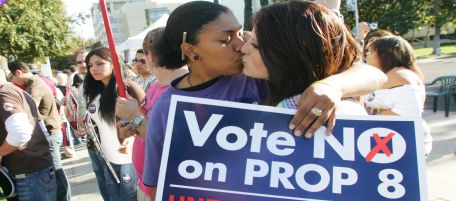 Nancy Ayllon, left, and Shawny Woodward kiss during a No on Proposition 8 rally Sunday, Nov. 2, 2008 in Fresno, Calif. If passed, Proposition 8 would overturn the California Supreme Court's decision earlier this year to legalize same-sex marriage. (AP Photo/Gary Kazanjian)
