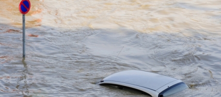 Only the roof of a car is visible in the floods of swollen Neisse river in the Eastern German town of Goerlitz Sunday Aug. 8, 2010. Police say heavy rain has caused flooding that killed three people in the eastern German state of Saxony after they were trapped in their basement. (AP Photo/ddp/ Norbert Millauer)
