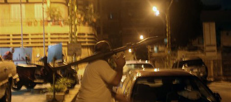 A gunman carries an RPG during clashes between supporters of the Shiite Hezbollah and a Sunni conservative group in the mixed residential area of Bourj Abu Haidar near central Beirut, Lebanon, Tuesday, Aug. 24, 2010. Lebanese Shiite and Sunni groups traded machine gun fire and grenades in Beirut on Tuesday, killing two people and wounding several others just blocks from a busy downtown packed with tourists at this time of year. (AP Photo)