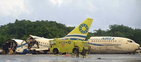A plane that crashed lays in pieces along the runaway at the airport on San Andres island in Colombia, Monday Aug. 16, 2010. The Boeing 737 operated by the airline Aires crashed on landing after departing from Bogota around midnight local time with 131 passengers. According to an Air Force official, at least one passenger died. (AP Photo/Periodico El Isleno, Richard Garcia)