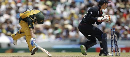 England's Craig Kieswetter, right, runs out Australia's David Hussey, left, at the final Twenty20 Cricket World Cup match in Bridgetown, Barbados, Sunday, May 16, 2010. (AP Photo/Aijaz Rahi)