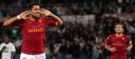 AS Roma'S Marco Borriello, left, celebrates after scoring during a Group E Champions League Soccer match between AS Roma and CFR Cluj, at Rome's Olympic stadium, Tuesday, Sept. 28, 2010. In the background at right is teammate Francesco Totti. (AP Photo/Gregorio Borgia)