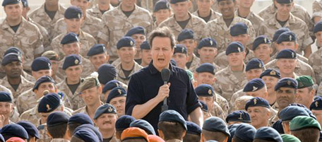 Britain's Prime Minister David Cameron, centre, addresses British soldiers, at Camp Bastion in Helmand Province, during his two day visit to Afghanistan, Friday June 11, 2010. (AP Photo/Stefan Rousseau, Pool)