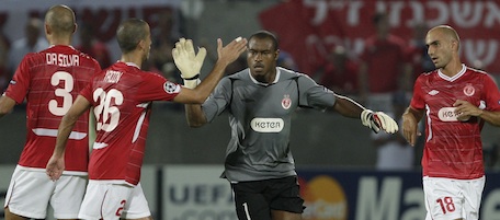 Hapoel Tel Aviv's goal keeper Vincent Enyeama , center celebrates his penalty goal against Lyon during their Champions league group B soccer match at the Bloomfield stadium in Tel Aviv, Israel, Wednesday, Sept. 29, 2010. (AP Photo/Ariel Schalit)