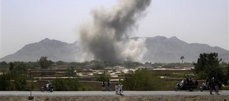 Smoke rises after NATO aircrafts conducted an air strike near the Arghandab river, south of Senjeray village, Kandahar province, where U.S. commanders had identified as insurgent positions Saturday, Sept. 11, 2010. (AP Photo/Todd Pitman)