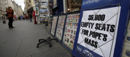 A banner advertises an edition of a local newspaper in central Edinburgh, Scotland, Wednesday Sept. 15, 2010. Pope Benedict XVI will visit Edinburgh Thursday as part of a four-day visit, the first-ever state visit by a Pope to Britain. (AP Photo/Lefteris Pitarakis)