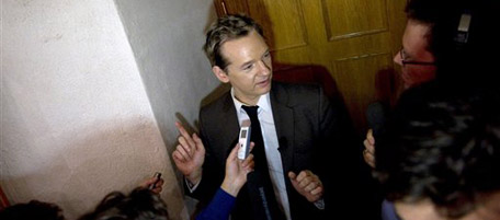 WikiLeaks founder Julian Assange is approached by the media after giving a seminar at the Swedish Trade Union Confederation headquarters in Stockholm, Sweden, Saturday Aug. 14, 2010. WikiLeaks will publish 15,000 documents from the Afghan war within weeks, Assange told reporters in Stockholm, saying "We proceed cautiously and safely with this material." although U.S. Pentagon says the information would be more damaging to security and risk more lives.(AP Photo / Bertil Ericson / SCANPIX) ** SWEDEN OUT **