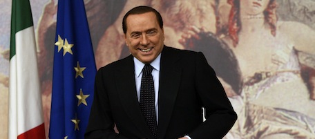 Italian Premier Silvio Berlusconi adjusts his jacket prior to a press conference at Chigi Palace, in Rome, Wednesday, Oct. 6, 2010. (AP Photo/Riccardo De Luca)