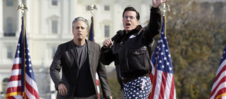 Comedians Stephen Colbert, right, and Jon Stewart perform in front of the U.S. Capitol during their Rally to Restore Sanity and/or Fear on the National Mall in Washington, Saturday, Oct. 30, 2010. The "sanity" rally blending laughs and political activism drew thousands to the mall with Stewart and Colbert casting themselves as the unlikely maestros of moderation and civility in polarized times. (AP Photo/Carolyn Kaster)