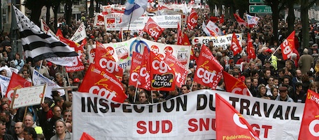 Unions flags, political parties flags and banners are seen while people march during a demonstration in Rennes, western France, Tuesday, Oct.19, 2010. The protesters are trying to prevent the French parliament from approving a bill that would raise the retirement age from 60 to 62 to help prevent the pension system from going bankrupt. (AP Photo/David Vincent)