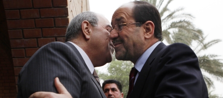 Iraq's former Prime Minister Ayad Allawi, left, greets current Prime Minister Nouri al-Maliki, right, before their meeting at Allawi's compound in Baghdad, Iraq, Tuesday, June 29, 2010. The Tuesday meeting was the second between the two men who are both battling to become the country's next prime minister since the inconclusive March 7 election. (AP Photo/Hadi Mizban)