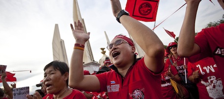 Anti-government chant slogans as they gather Sunday, Oct. 10, 2010, in Bangkok. The Red Shirt demonstrators staged a peaceful protest at Democracy Monument lighting candles and singing songs in honor of fallen comrades.(AP Photo/David Longstreath)