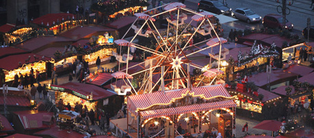 DRESDEN, GERMANY - NOVEMBER 26: A ferris wheel turns at the Dresdner Striezelmarkt Christmas market on November 26, 2010 in Dresden, Germany. The Striezelmarkt claims to be Germany's oldest Christmas market and dates back to 1434. Christmas markets have a long tradition in Germany and usually sell gluhwein, Christmas decorations and ornaments, sweets and sausages. (Photo by Sean Gallup/Getty Images)