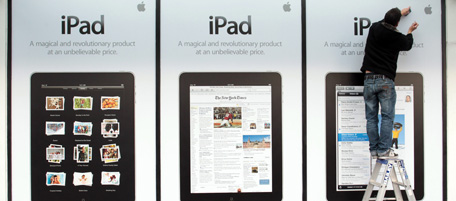 A worker puts up signs for the new iPad before it's launch in New Zealand at a Apple store in Auckland on July 23 2010. The third phase of Apple's global rollout of the much-hyped iPad was launched in New Zealand with fans of the brand expressing frustration at the extreme secrecy surrounding the release. AFP PHOTO/Brendon O'Hagan (Photo credit should read BRENDON O'HAGAN/AFP/Getty Images)