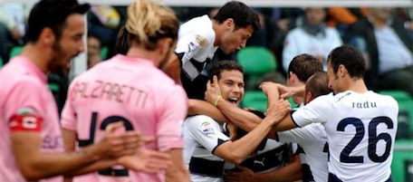 Lazio's Andre Dias of Brazil, at center, covered by his teammates, celebrates after scoring during the Serie A soccer match between Palermo and Lazio, in Palermo, Italy, Sunday, Oct. 31, 2010. (AP Photo/Alessandro Fucarini)