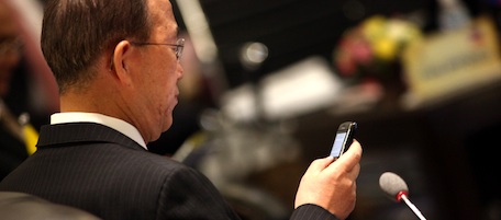 United Nations Secretary General Ban Ki-moon (C) checks his phone as he attends the ASEAN-UN Summit held on the sidelines of the 17th summit of the Association of Southeast Asian Nations (ASEAN) in Hanoi on October 29, 2010. Talking to reporters on the sidelines of a meeting with leaders of the 10-member Association of Southeast Asian Nations (ASEAN) Ban said he hoped for more Southeast Asian involvement in UN peacekeeping missions across the globe. AFP PHOTO / POOL / Na Son Nguyen (Photo credit should read Na Son Nguyen/AFP/Getty Images)