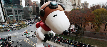 NEW YORK - NOVEMBER 25: The Snoopy float glides down Central Park South during the Macy's Thanksgiving Day parade November 25, 2010 in New York City. This year's annual parade features approximately 8,000 participants, 15 giant character balloons and 43 novelty balloons. (Photo by Chris Hondros/Getty Images)