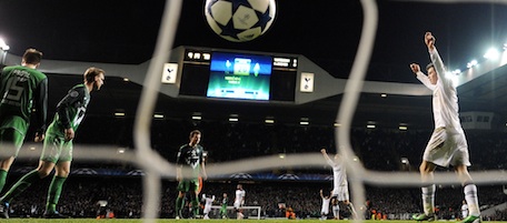 Tottenham Hotspurs' Gareth Bale (R) celebrates as the ball bounces into the net after Peter Crouch (not seen) scored the third goal against Werder Bremen during the UEFA Champions League group A football match at White Hart Lane in London on November 24, 2010. Tottenham won the game 3-0 and qualify for the knockout phase of the competition. AFP PHOTO / Adrian Dennis (Photo credit should read ADRIAN DENNIS/AFP/Getty Images)