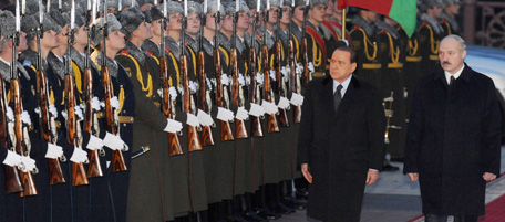 Italian Prime Minister Silvio Berlusconi (L) and Belarus President Alexander Lukashenko inspect guards of honour during their meeting in Minsk on November 30, 2009. Italian Prime Minister Silvio Berlusconi arrived in Belarus on Monday, making the first visit by a Western leader in 15 years to the country. AFP PHOTO / VIKTOR DRACHEV (Photo credit should read VIKTOR DRACHEV/AFP/Getty Images)