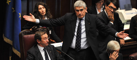 The speaker of Italy's parliament Gianfranco Fini (L) and the Union of the Centre (UDC) party leader Pier Ferdinando Casini react during a confidence vote at the Chamber of Deputies, the lower house, on December 14, 2010 in Rome. Berlusconi scraped through a crucial confidence vote in the lower house of parliament by 314 votes in favour and 311 against. AFP PHOTO / ANDREAS SOLARO (Photo credit should read ANDREAS SOLARO/AFP/Getty Images)
