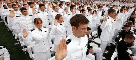 Midshipmen, both from the Navy and the Marine Corps toss their hats into the air at the conclusion of the graduation ceremony at the United States Naval Academy May 28, 2010 in Annapolis, Maryland. 1,028 midshipmen, including 219 women, earned their commissions during the Naval Academy's 160th traditional graduation ceremony.