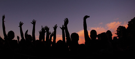 SYDNEY, AUSTRALIA - DECEMBER 11: Fans raise their arms as Jack Johnson performs on stage at The Domain on December 11, 2010 in Sydney, Australia. (Photo by Mark Metcalfe/Getty Images)