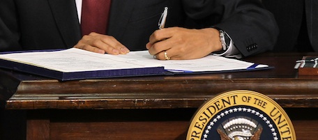 WASHINGTON, DC - DECEMBER 17: U.S. President Barack Obama signs H.R. 4853 the Tax Relief, Unemployment Insurance Reauthorization and Job Creation Act of 2010 into law December 17, 2010 at Eisenhower Executive Office Building of the White House in Washington, DC. The $858 billion bill will extend the Bush era tax cuts for two more years, and unemployment benefits for 13 months. (Photo by Alex Wong/Getty Images)