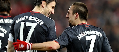 RESTRICTIONS / EMBARGO - ONLINE CLIENTS MAY USE UP TO SIX IMAGES DURING EACH MATCH WITHOUT THE AUTHORISATION OF THE DFL. NO MOBILE USE DURING THE MATCH AND FOR A FURTHER TWO HOURS AFTERWARDS IS PERMITTED WITHOUT THE AUTHORISATION OF THE DFL.
Bayern Munich's French midfielder Franck Ribery (R) shares a smile with Dutch teammate Mark van Bommel during the German first division Bundesliga football match VfB Stuttgart vs FC Bayern Munich in the southern German city of Stuttgart on December 19, 2010. AFP PHOTO / THOMAS KIENZLE (Photo credit should read THOMAS KIENZLE/AFP/Getty Images)
