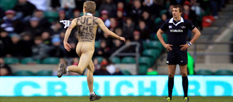 LONDON, ENGLAND - DECEMBER 09: (EDITOR'S NOTE: NUDITY &amp; PROFANITY) A streaker runs on the pitch in support of the student protests during the Varsity Match between Oxford University and Cambridge University at Twickenham Stadium on December 9, 2010 in London, England. Parliament is voting today on whether to implement the coalition Government's proposals to increase university tuition fees in England from 3,290 GBP to 9,000 GBP. (Photo by Mark Thompson/Getty Images)