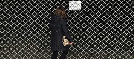 A woman reads a sign set up in front of a closed metro entrance in Athens during the 24-hours public transport emloyees strike on January 13, 2011. The Greek capital was paralysed today by a new 24-hour transport strike, the fifth since December, against plans by the Socialist government to overhaul its ailing bus, train and metro companies. A government bill to streamline the debt-ridden public transport companies unveiled this week is part of emergency measures adopted to slash state deficits that nearly bankrupted the economy last year. AFP PHOTO / LOUISA GOULIAMAKI (Photo credit should read LOUISA GOULIAMAKI/AFP/Getty Images)