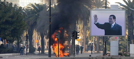 Smoke rises from fire left after clashes between security forces and demonstrators in Tunis on January 14, 2011 after Tunisian President Zine El Abidine Ben Ali's address to the nation. Tunisian President Zine El Abidine Ben Ali has sacked the government and called early elections in six months, the prime minister announced as weeks of deadly unrest mounted with new clashes.
 AFP PHOTO / FETHI BELAID (Photo credit should read FETHI BELAID/AFP/Getty Images)