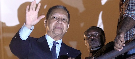 PORT-AU-PRINCE, HAITI - JANUARY 16: Jean-Claude Duvalier, the former Haitian leader known as 'Baby Doc', waves to supporters from a balcony of the Hotel Karibe on January 16, 2011 in Port-au-Prince, Haiti. Duvalier was greeted by supporters upon returning to his homeland for the first time in 25 years from his exile in France. (Photo by Mario Tama/Getty Images) *** Local Caption *** Jean-Claude Duvalier