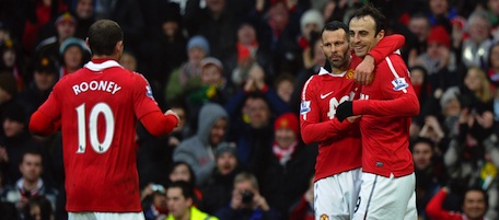 Manchester United's Bulgarian striker Dimitar Berbatov (R) celebrates scoring his second goal with Welsh midfielder Ryan Giggs (2nd R) and English striker Wayne Rooney (R) during the English Premier League football match between Manchester United and Birmingham City at Old Trafford in Manchester, north-west England on January 22, 2011. AFP PHOTO/PAUL ELLIS

RESTRICTED TO EDITORIAL USE Additional licence required for any commercial/promotional use or use on TV or internet (except identical online version of newspaper) of Premier League/Football League photos. Tel DataCo +44 207 2981656. Do not alter/modify photo (Photo credit should read PAUL ELLIS/AFP/Getty Images)